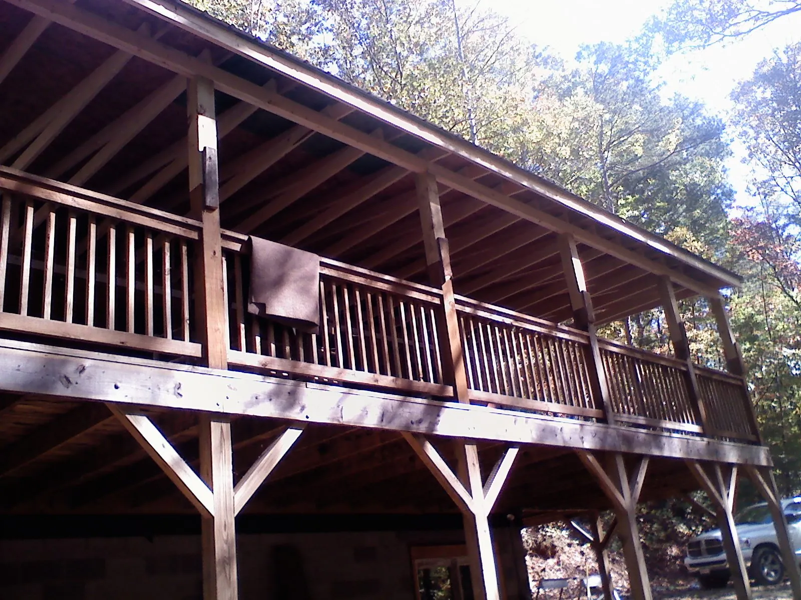Timber framing under a new elevated porch and deck — Roof Leak Repair in East Rochester by Roofing Brothers
